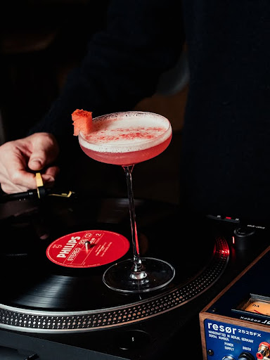Cocktail and a record on the turntable